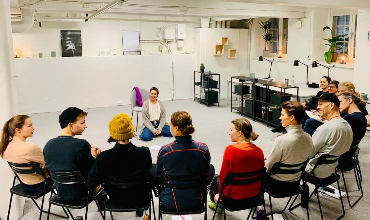 Actors sitting in a circle during a workshop at Actors Academy Finland